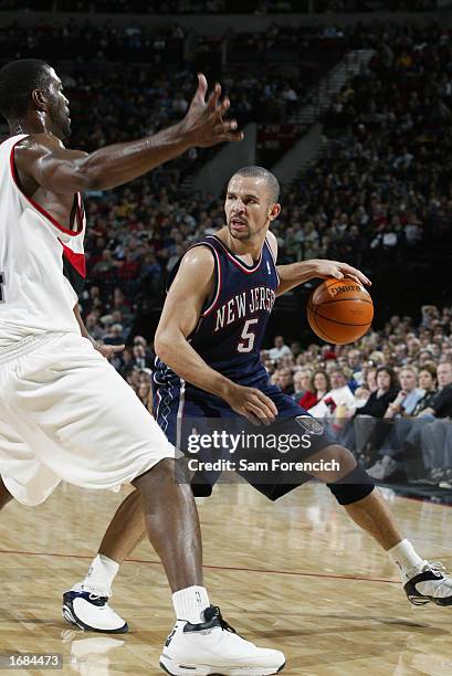 Jason Kidd of the New Jersey Nets looks to pass against the Portland Trail Blazers during the game at the Rose Garden on November 30, 2002 in...