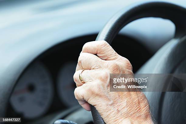 hand of senior man driver on car steering wheel - hairy old man stock pictures, royalty-free photos & images