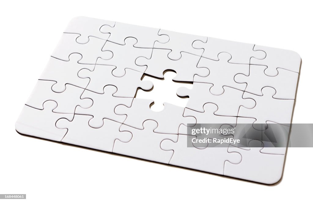 The missing link: incomplete all-white jigsaw puzzle on white