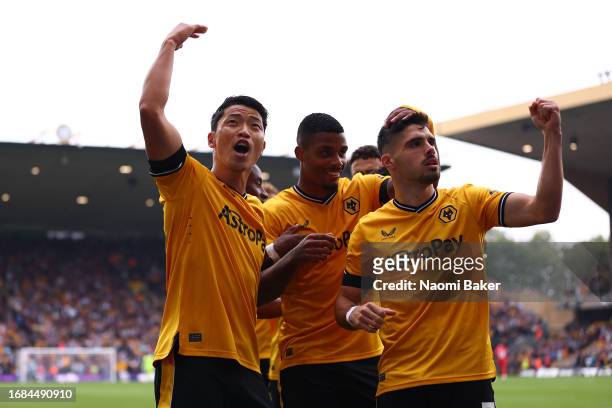 Hwang Hee-Chan of Wolverhampton Wanderers celebrates with team mates after scoring their sides first goal during the Premier League match between...