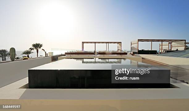 infinity-pool, teneriffa - playa de las americas stock-fotos und bilder