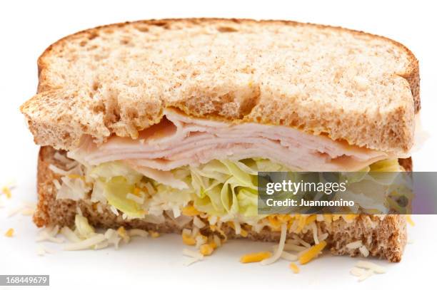 sandwich with half turkey and cheese - whole wheat sandwich stock pictures, royalty-free photos & images