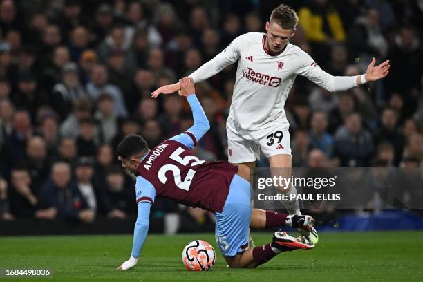 Burnley's Swiss striker Zeki Amdouni vies with Manchester United's Scottish midfielder Scott McTominay during the English Premier League football...