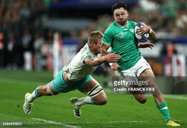 Ireland's full-back Hugo Keenan is tackled by South Africa's openside flanker Pieter-Steph du Toit during the France 2023 Rugby World Cup Pool B...