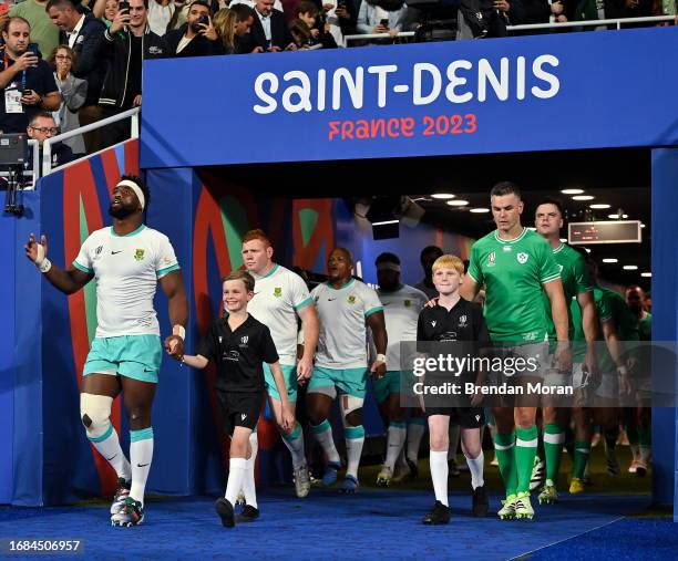 Paris , France - 23 September 2023; Team captains Siya Kolisi of South Africa and Jonathan Sexton of Ireland lead out their respective teams for the...