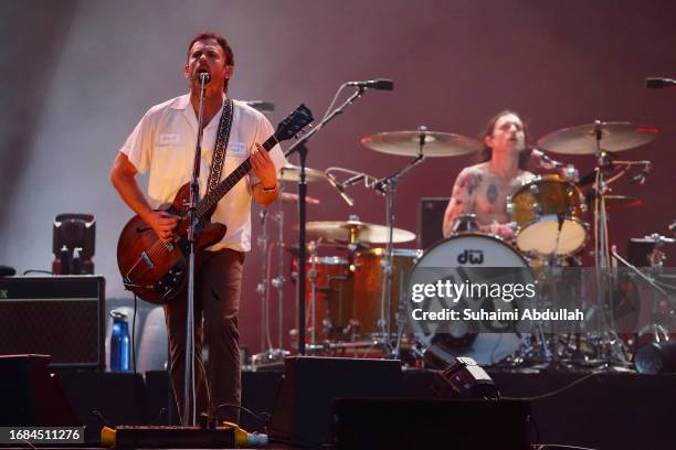 Nathan Followill and Caleb Followill of Kings of Leon perform at the Singapore Formula One Grand Prix at Marina Bay Street Circuit on September 16,...