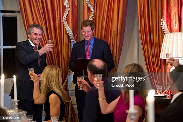 Prince Harry and British Ambassador Sir Peter Westmacott speak at a dinner at the British Ambassador's residence on May 9, 2013 in Washington,DC.