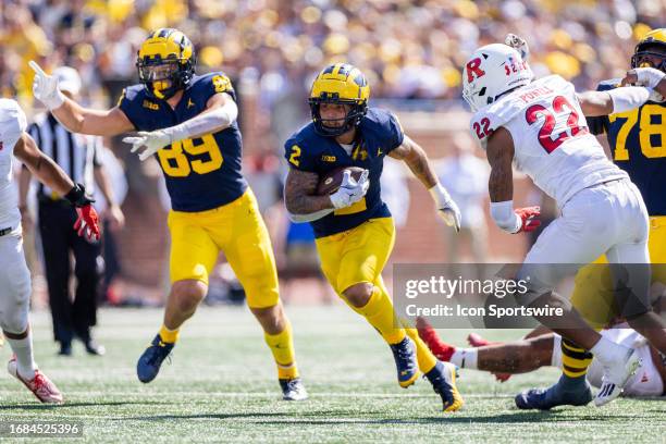 Michigan Wolverines running back Blake Corum runs the ball during the college men's football game between the Rutgers Scarlet Knights and the...