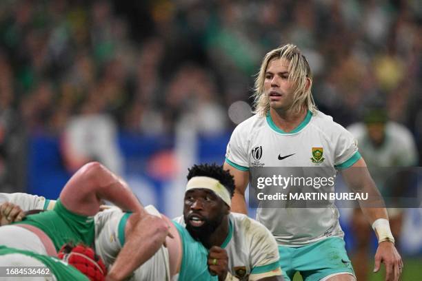 South Africa's scrum-half Faf de Klerk stands next to South Africa's blindside flanker Siya Kolisi during the France 2023 Rugby World Cup Pool B...