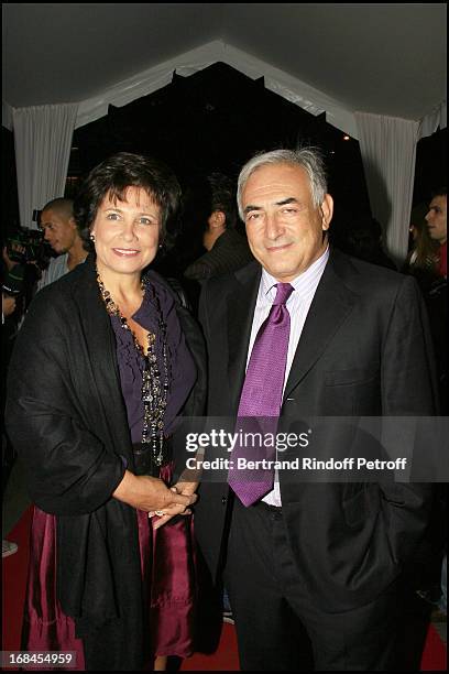 Dominique Strauss Kahn and his wife Anne Sinclair - premiere of the movie "Indigenes" by Rachid Bouchareb at the UGC Normandie on the Champs Elysees...