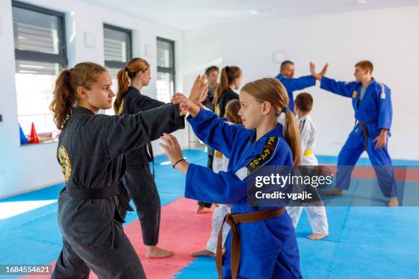 children in kimono on real aikido training - black belt stock pictures, royalty-free photos & images