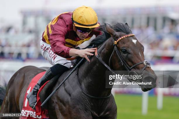 Tom Marquand riding Iberian win The Betfred Champagne Stakes at Doncaster Racecourse on September 16, 2023 in Doncaster, England.