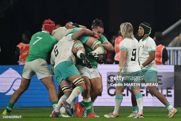 South Africa's lock Eben Etzebeth is lifted by Ireland's left wing James Lowe in a maul during the France 2023 Rugby World Cup Pool B match between...