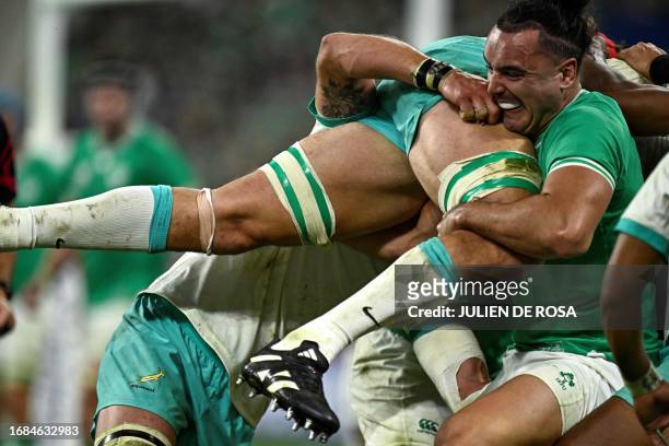 Ireland's left wing James Lowe lifts South Africa's lock Eben Etzebeth during the France 2023 Rugby World Cup Pool B match between South Africa and...