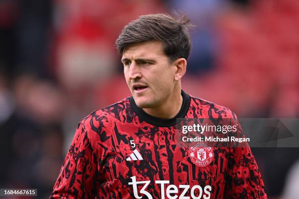 Harry Maguire of Manchester United warms up prior to the Premier League match between Manchester United and Brighton & Hove Albion at Old Trafford on...