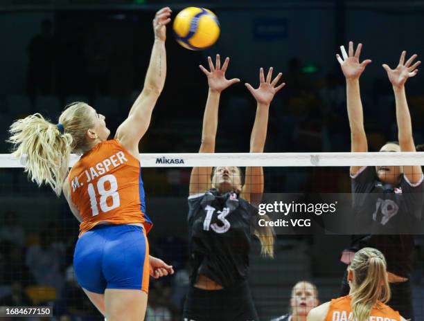 Jasper Marrit of Netherlands competes against Maglio Emily and King Brie of Canada in the FIVB Volleyball Women's Olympic Qualifying Tournament -...