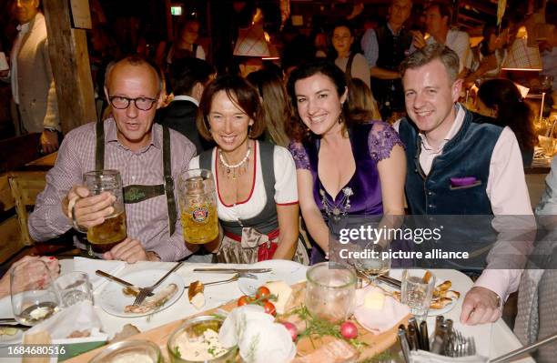 September 2023, Bavaria, Munich: Friedrich Merz , party chairman of the CDU, and his wife Charlotte Merz, as well as politician Dorothee Bär and her...