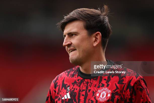 Harry Maguire of Manchester United looks on as he warms up prior to the Premier League match between Manchester United and Brighton & Hove Albion at...