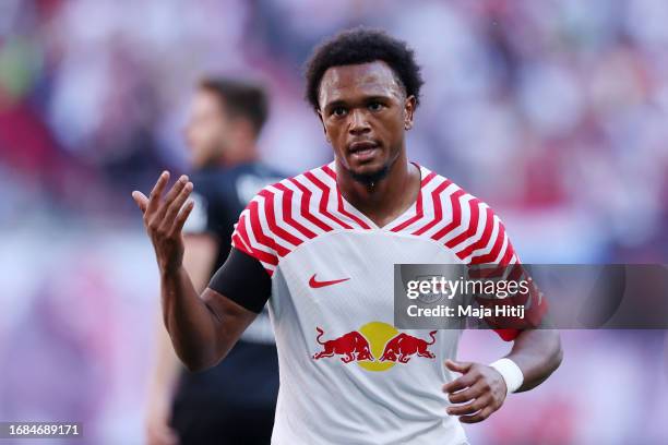 Lois Openda of RB Leipzig celebrates after scoring their sides second goal during the Bundesliga match between RB Leipzig and FC Augsburg at Red Bull...