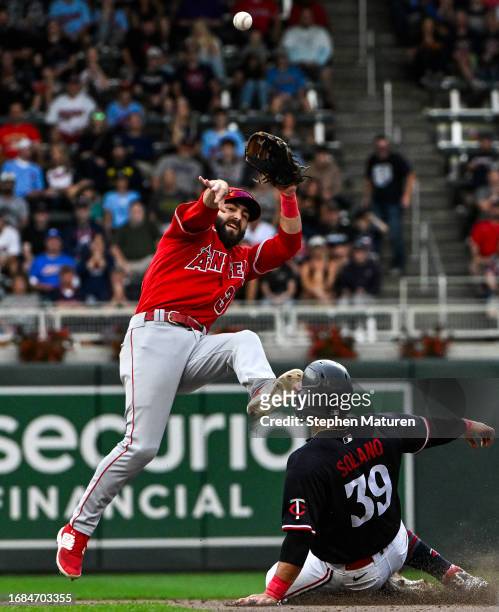Michael Stefanic of the Los Angeles Angels throws the ball to first base on a double play in the eighth inning against the Minnesota Twins at Target...
