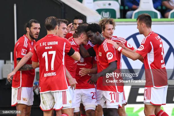 Robin Gosens of 1.FC Union Berlin celebrates with Datro Fofana after scoring their sides first goal during the Bundesliga match between VfL Wolfsburg...