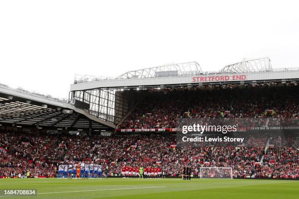 Players, Match officials and fans take part in a minute's silence for the victims of the Morocco earthquake prior to the Premier League match between...