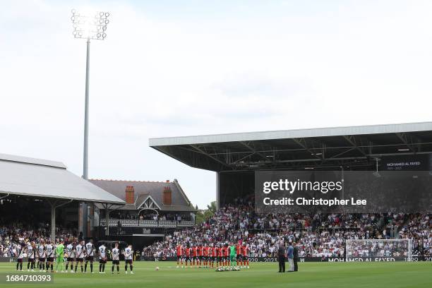 Players, match officials and fans take part in a minute's silence for the victims of the Morocco earthquake prior to the Premier League match between...