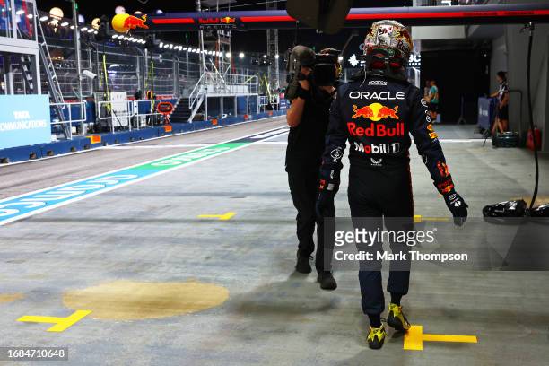 13th placed qualifier Sergio Perez of Mexico and Oracle Red Bull Racing walks in the Pitlane during qualifying ahead of the F1 Grand Prix of...