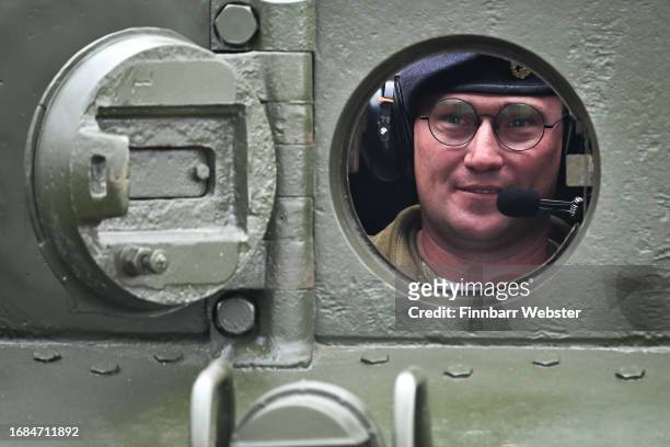 Driver looks out from a Centaur tank at the Tank Museum, on September 16, 2023 in Bovington, Dorset. The Tank Museum's Tiger 131 is currently the...