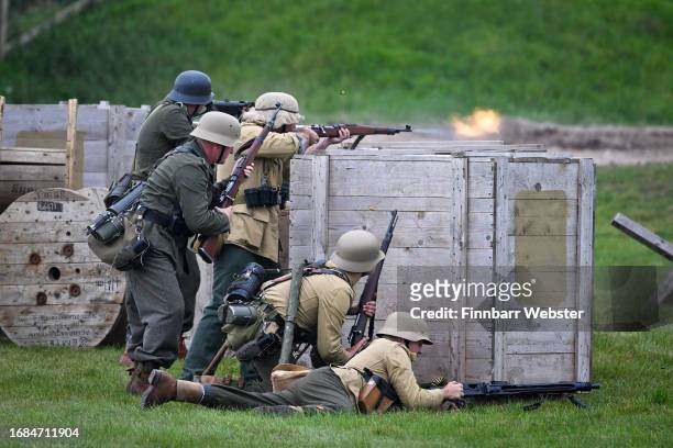 German re-enactors fire their gun during the Tiger tank display, on September 16, 2023 in Bovington, Dorset. The Tank Museum's Tiger 131 is currently...