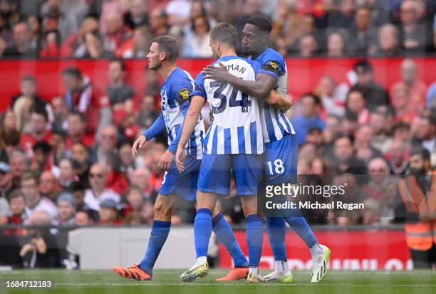 Danny Welbeck of Brighton & Hove Albion celebrates with team mate Joel Veltman after scoring their sides first goal during the Premier League match...
