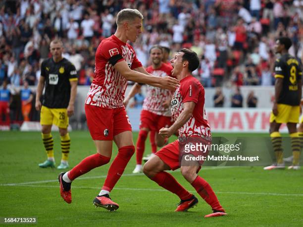 Nicolas Hoefler of Sport-Club Freiburg celebrates with his teammate Matthias Ginter of Sport-Club Freiburg after scoring the team's second goal...