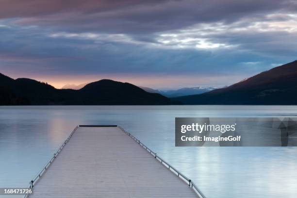 dock bei sonnenuntergang - lake whitefish stock-fotos und bilder