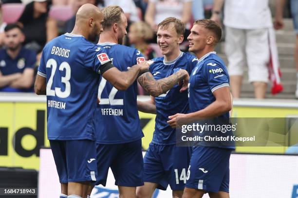 Maximilian Beier of Hoffenheim celebrates the third goal with his team mates during the Bundesliga match between 1. FC Köln and TSG Hoffenheim at...