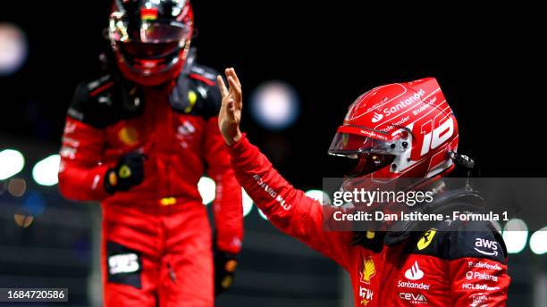 Third placed qualifier Charles Leclerc of Monaco and Ferrari celebrates in parc ferme during qualifying ahead of the F1 Grand Prix of Singapore at...