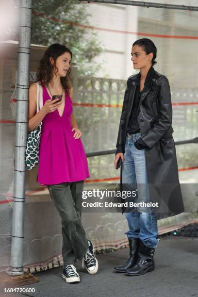 Model wears a pink gathered dress and gray denim jeans pants, Converse sneakers ; a model wears a black long leather jacket, a black shirt, blue...