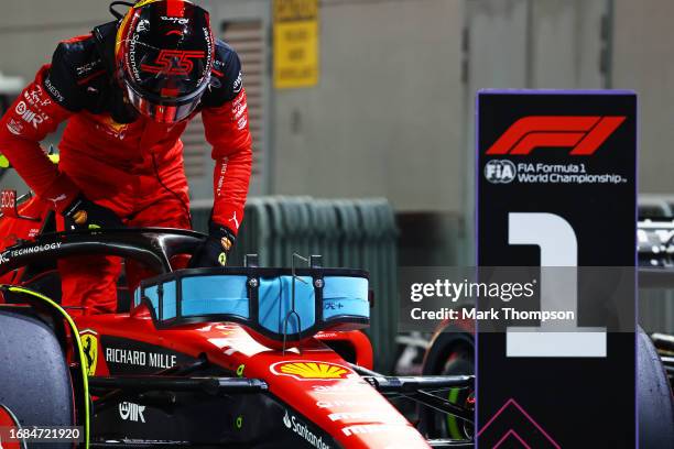 Pole position qualifier Carlos Sainz of Spain and Ferrari stops in parc ferme during qualifying ahead of the F1 Grand Prix of Singapore at Marina Bay...