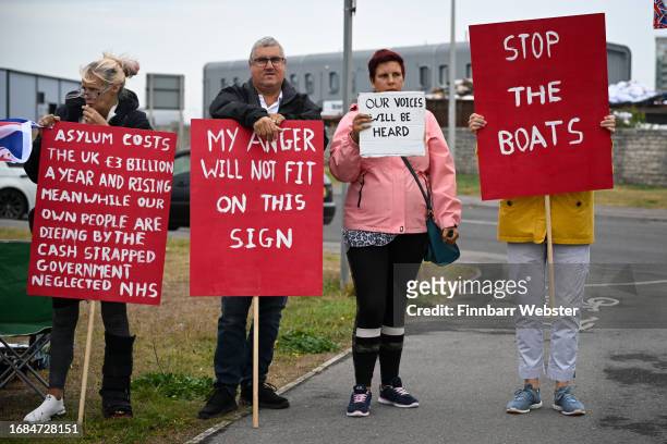 Protesters against illegal immigration and the Bibby Stockholm barge demonstrate, on September 16, 2023 in Portland, England. The floating...