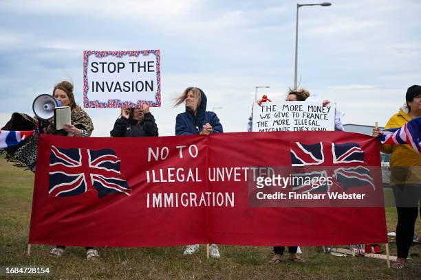 Protesters against illegal immigration and the Bibby Stockholm barge demonstrate, on September 16, 2023 in Portland, England. The floating...