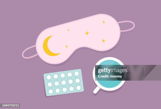 eye mask, cup, and sleeping pills on a table for insomnia concept - eye mask stock illustrations