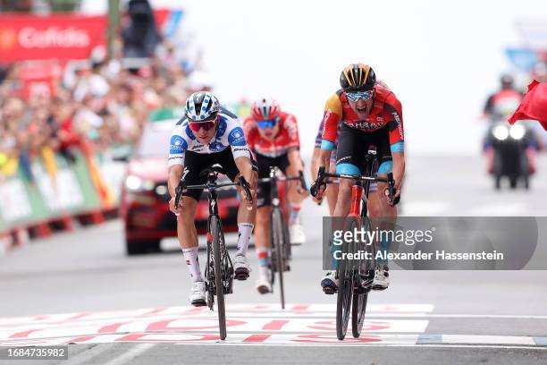 Remco Evenepoel of Belgium and Team Soudal - Quick Step - Polka dot Mountain Jersey and Wout Poels of The Netherlands and Team Bahrain - Victorious...