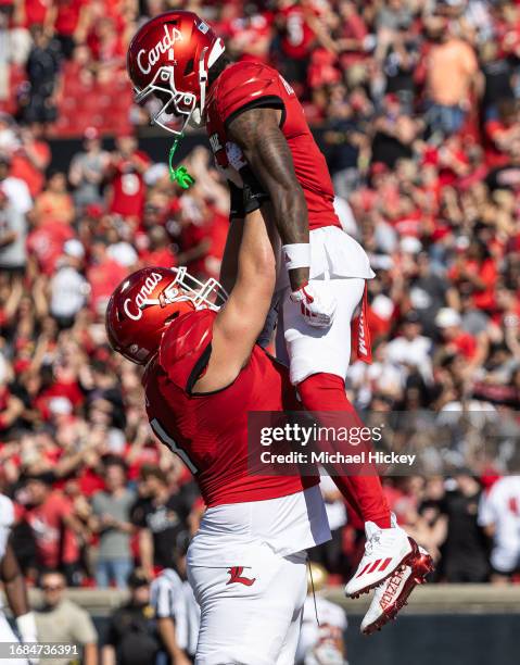 Austin Collins and Ahmari Huggins-Bruce of the Louisville Cardinals celebrate after a touchdown during the first half against the Boston College...