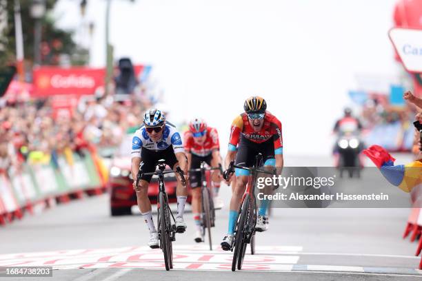 Remco Evenepoel of Belgium and Team Soudal - Quick Step - Polka dot Mountain Jersey and Wout Poels of The Netherlands and Team Bahrain - Victorious...