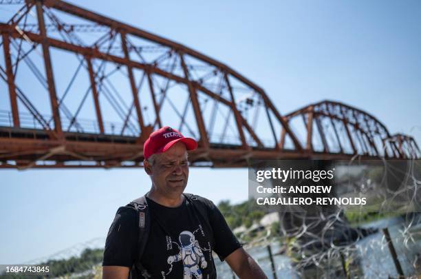 Francisco, from Venezuela, cries, as he talks about the family he left behind, after crossing the Rio Grande from Mexico at Eagle Pass, Texas, on...