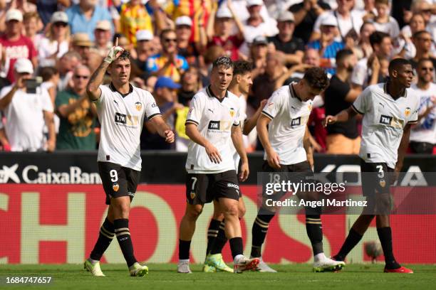 Hugo Duro of Valencia CF celebrates after scoring the team's second goal during the LaLiga EA Sports match between Valencia CF and Atletico Madrid at...