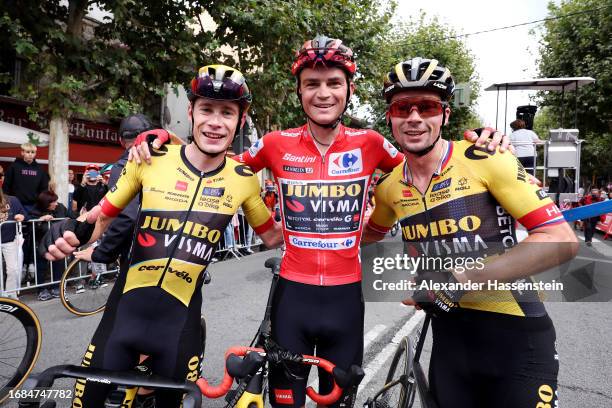 Jonas Vingegaard of Denmark, Sepp Kuss of The United States - Red Leader Jersey final overall winner and Primoz Roglic of Slovenia and Team...