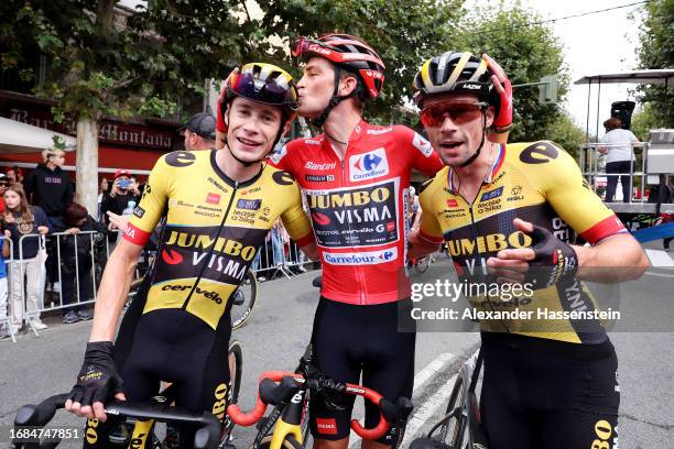 Jonas Vingegaard of Denmark, Sepp Kuss of The United States - Red Leader Jersey final overall winner and Primoz Roglic of Slovenia and Team...