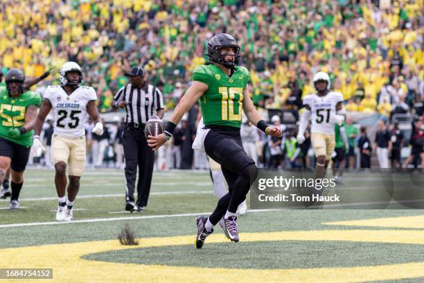 Quarterback Bo Nix of the Oregon Ducks runs for a touchdown against the Colorado Buffaloes during the first half at Autzen Stadium on September 23,...