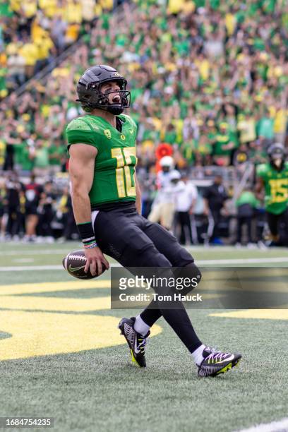 Quarterback Bo Nix of the Oregon Ducks runs for a touchdown against the Colorado Buffaloes during the first half at Autzen Stadium on September 23,...