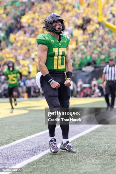 Quarterback Bo Nix of the Oregon Ducks runs for a touchdown against the Colorado Buffaloes during the first half at Autzen Stadium on September 23,...